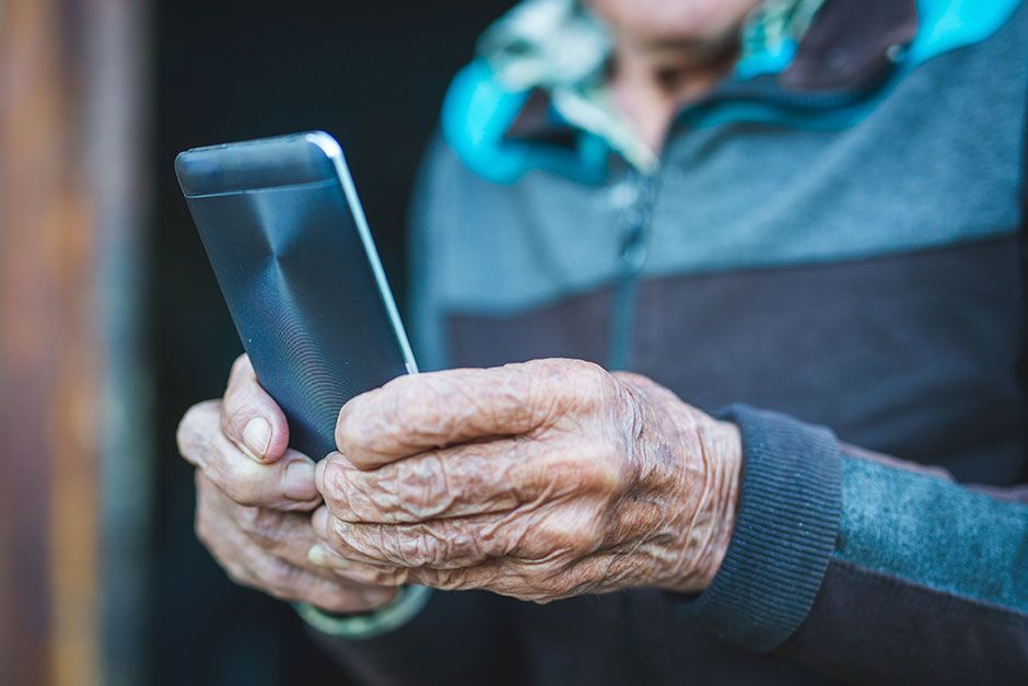 COVID-19 Pre-screening | Elderly Man Reading Messages on Smartphone