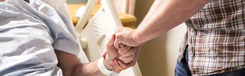 Person Holding Hand Of A Patient