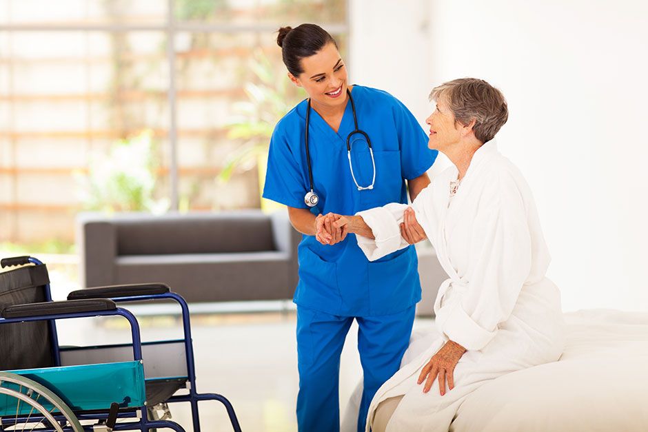 Reducing Hospital Readmissions: 5 Strategies | Nurse Helping Patient Out of Bed