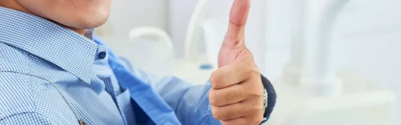 Smiling Women Giving Thumbs Up