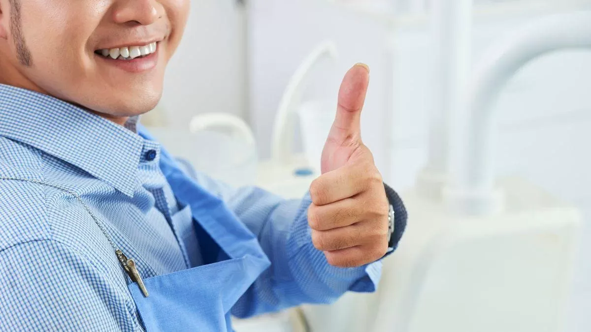 Smiling Women Giving Thumbs Up