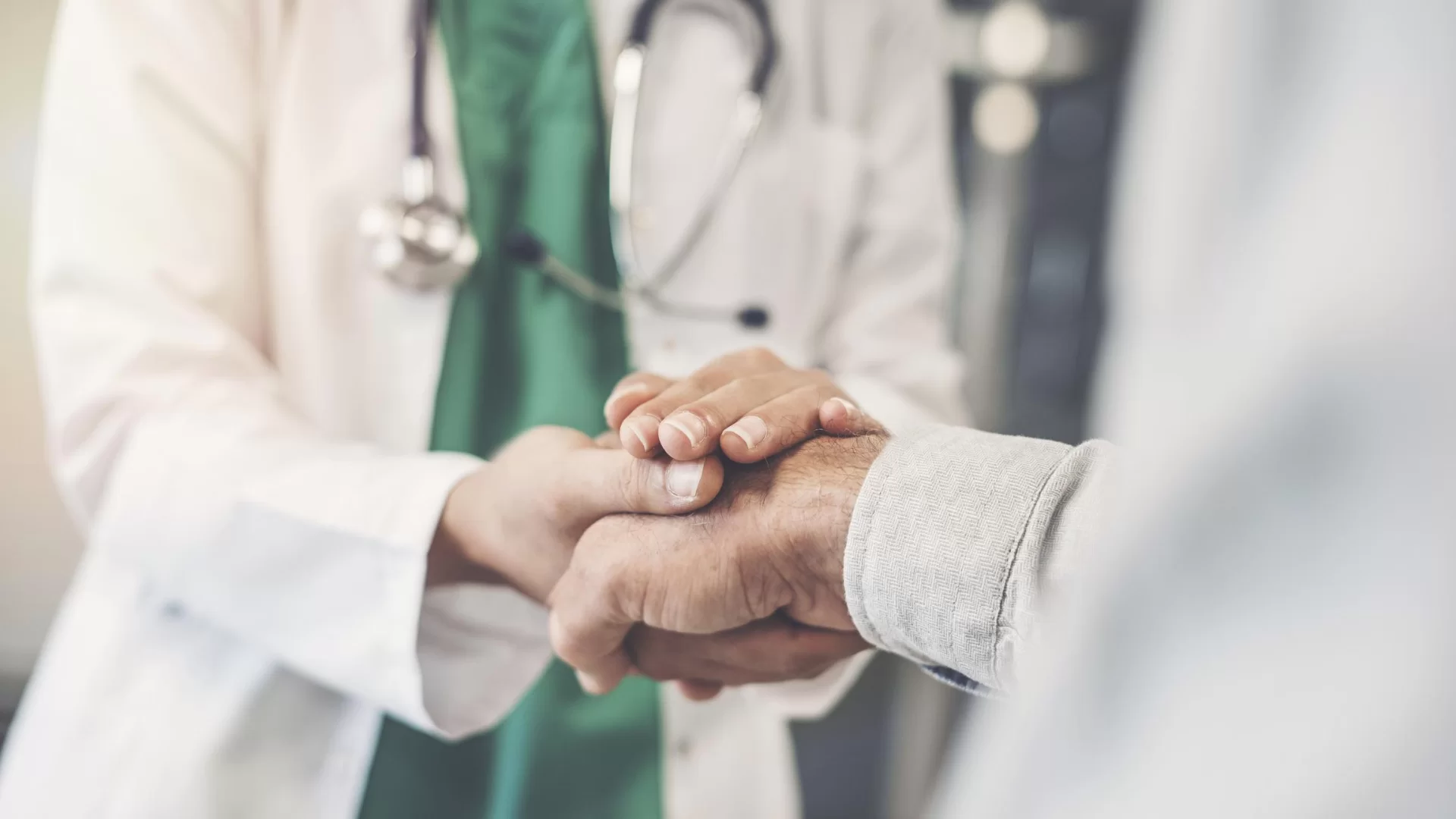 Doctor Holding Patient's Hand