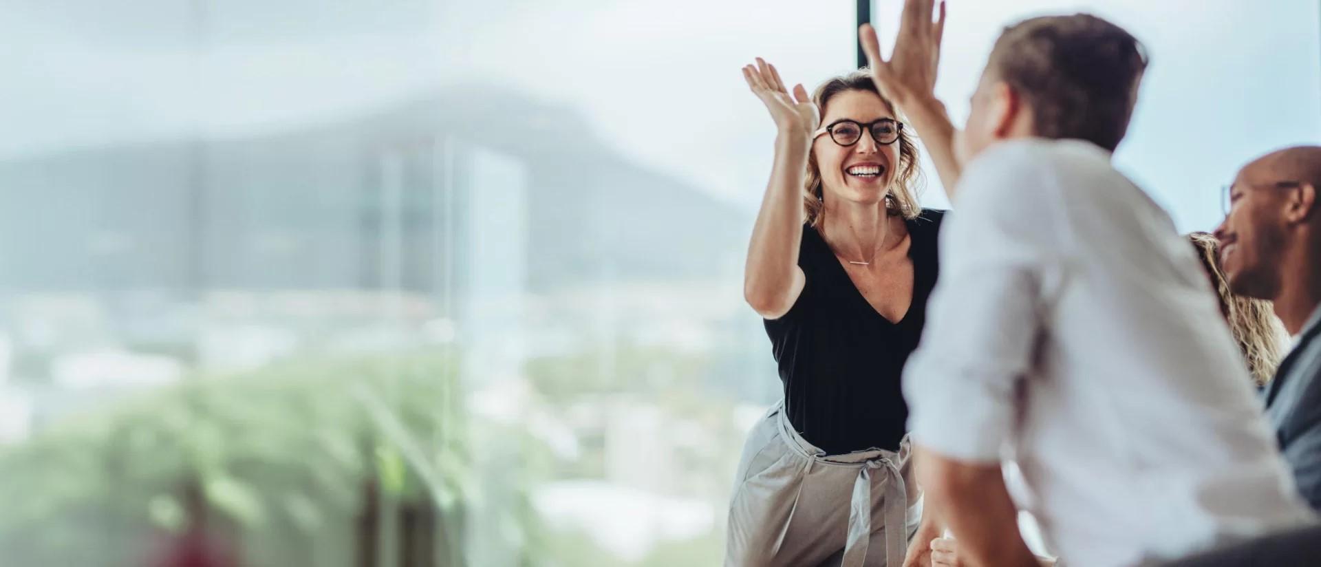 Woman And Man Giving High Five