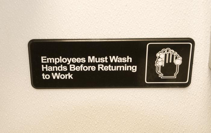 Sign Stating Employees Must Wash Hands Before Returning to Work