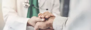 Doctor Holding Patient's Hand
