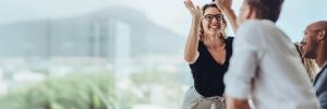 Woman And Man Giving High Five